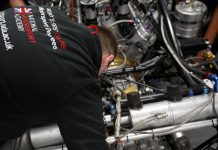 A student from the National Motorsport Academy working on a racecar